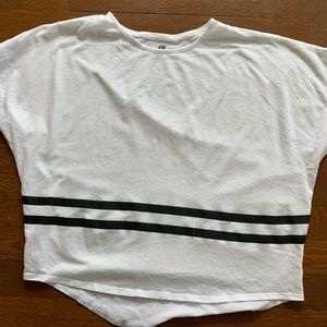 White t-shirt with black stripes.